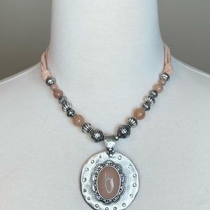 Chico’s Silver-toned collar length necklace with silver pendant and pink stone